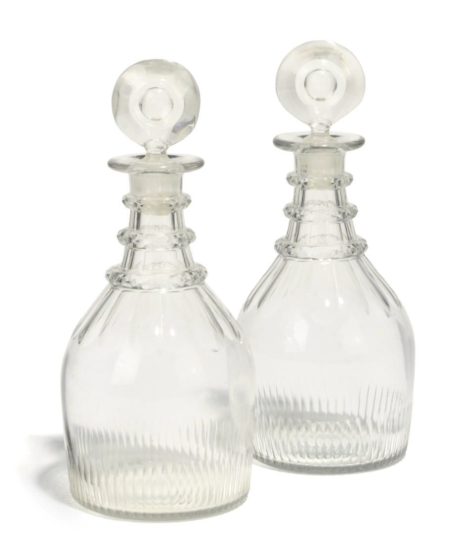 A PAIR OF ENGLISH CUT-GLASS DECANTERS AND STOPPERS