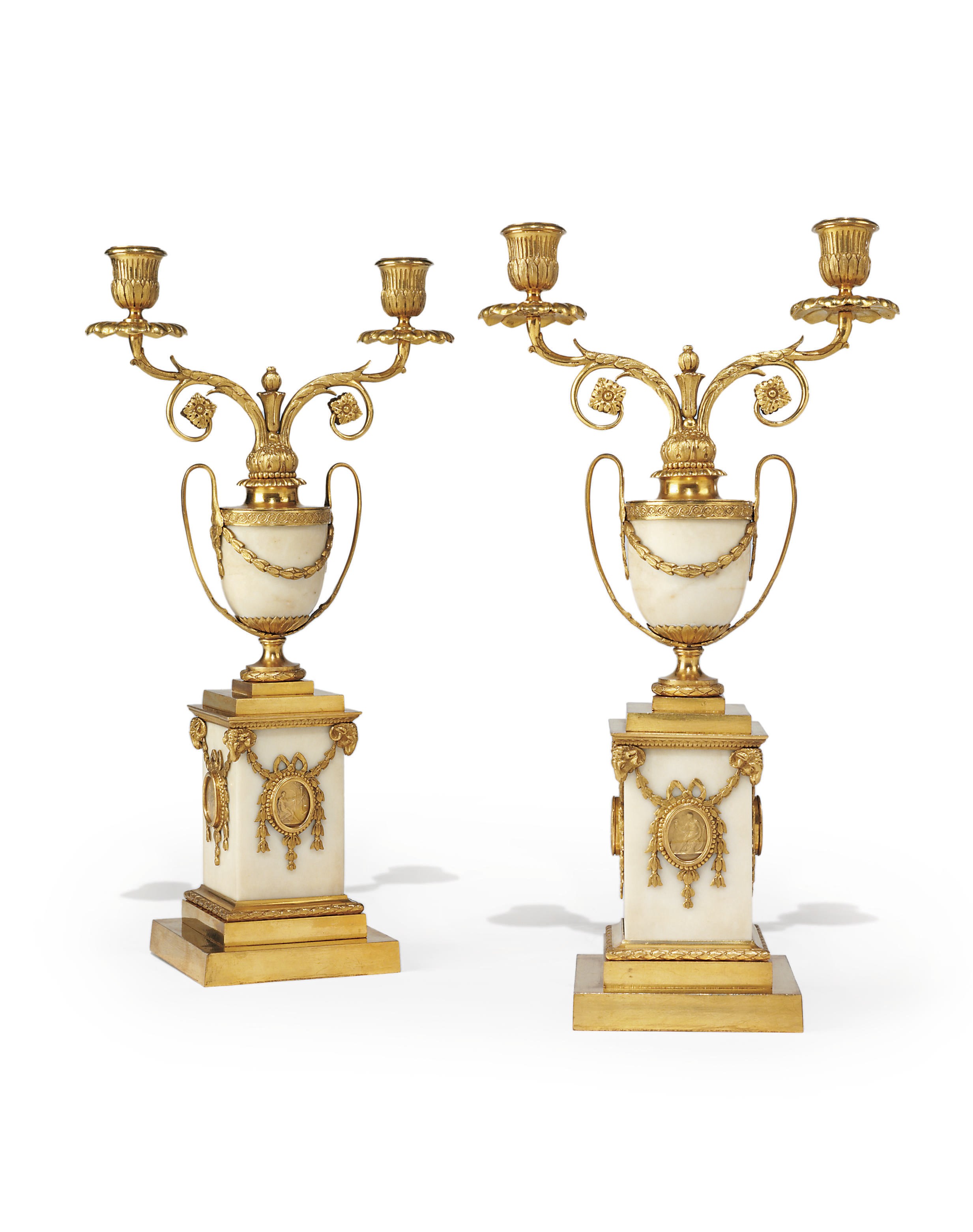 A PAIR OF GEORGE III ORMOLU AND WHITE MARBLE TWO-LIGHT CANDELABRA
