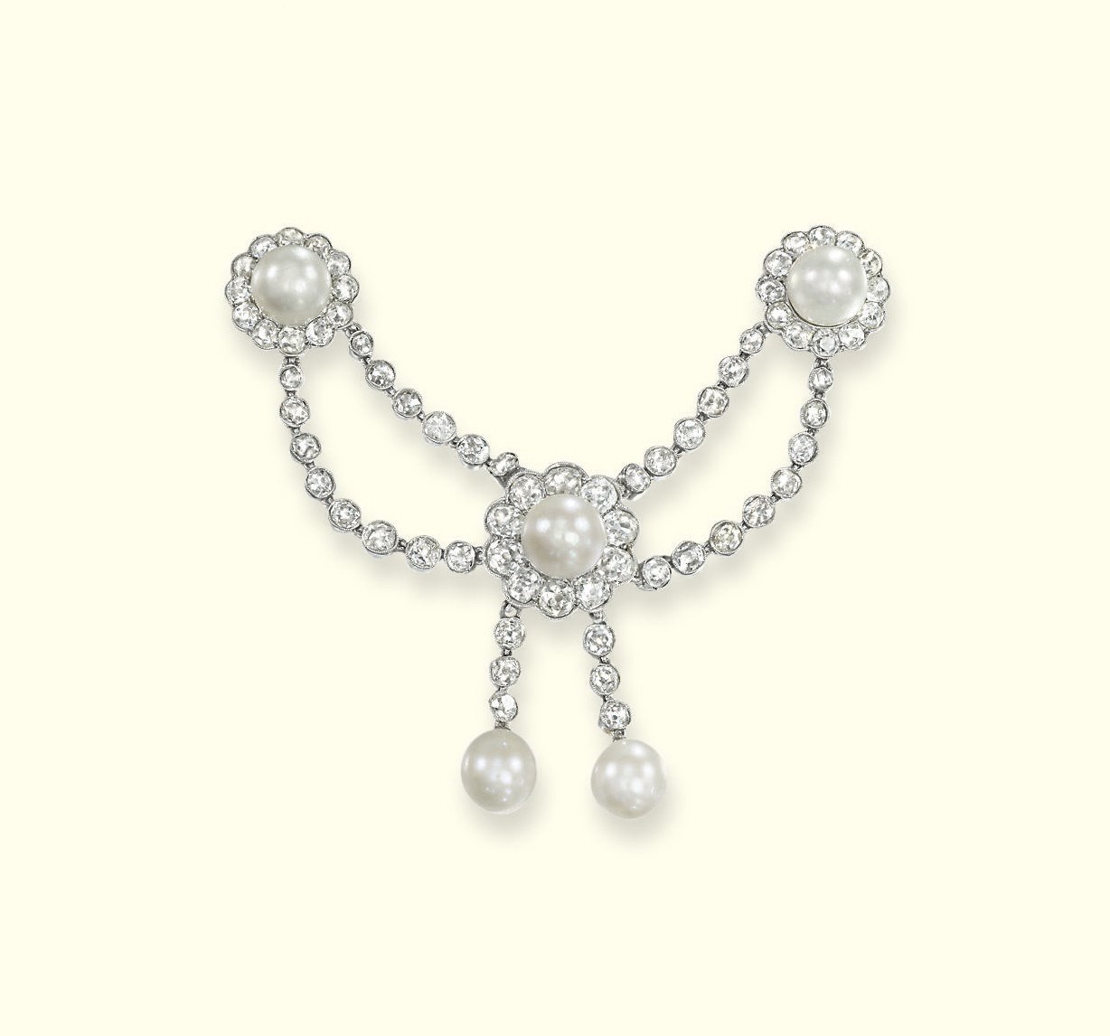 A BELLE EPOQUE PEARL AND DIAMOND 'DRAPERIE' JABOT PIN