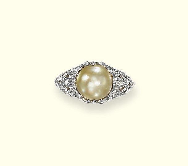 A NATURAL PEARL AND DIAMOND RING