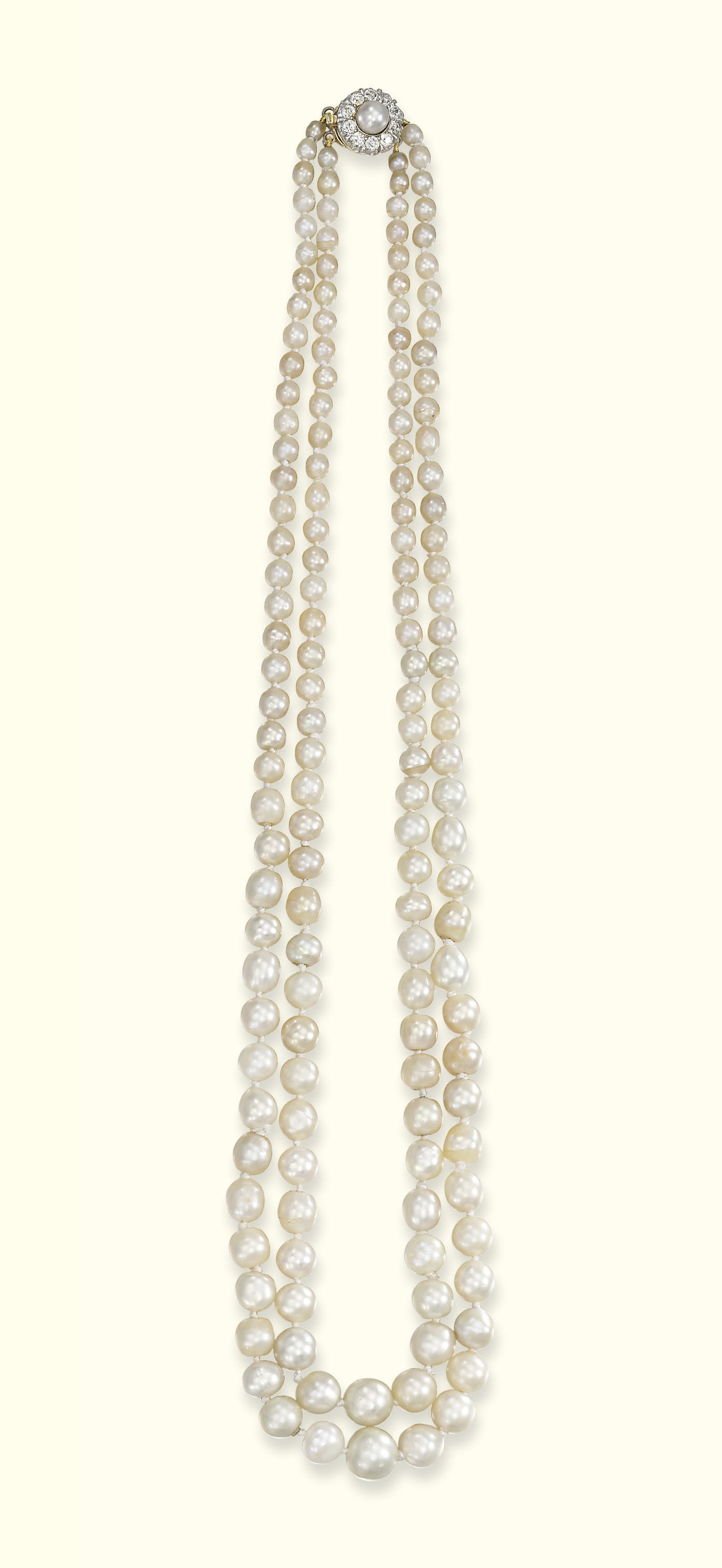 A TWO-ROW NATURAL PEARL NECKLACE
