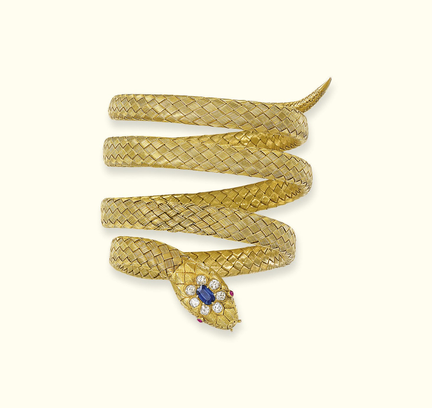 AN ANTIQUE GOLD AND GEM-SET SNAKE BANGLE