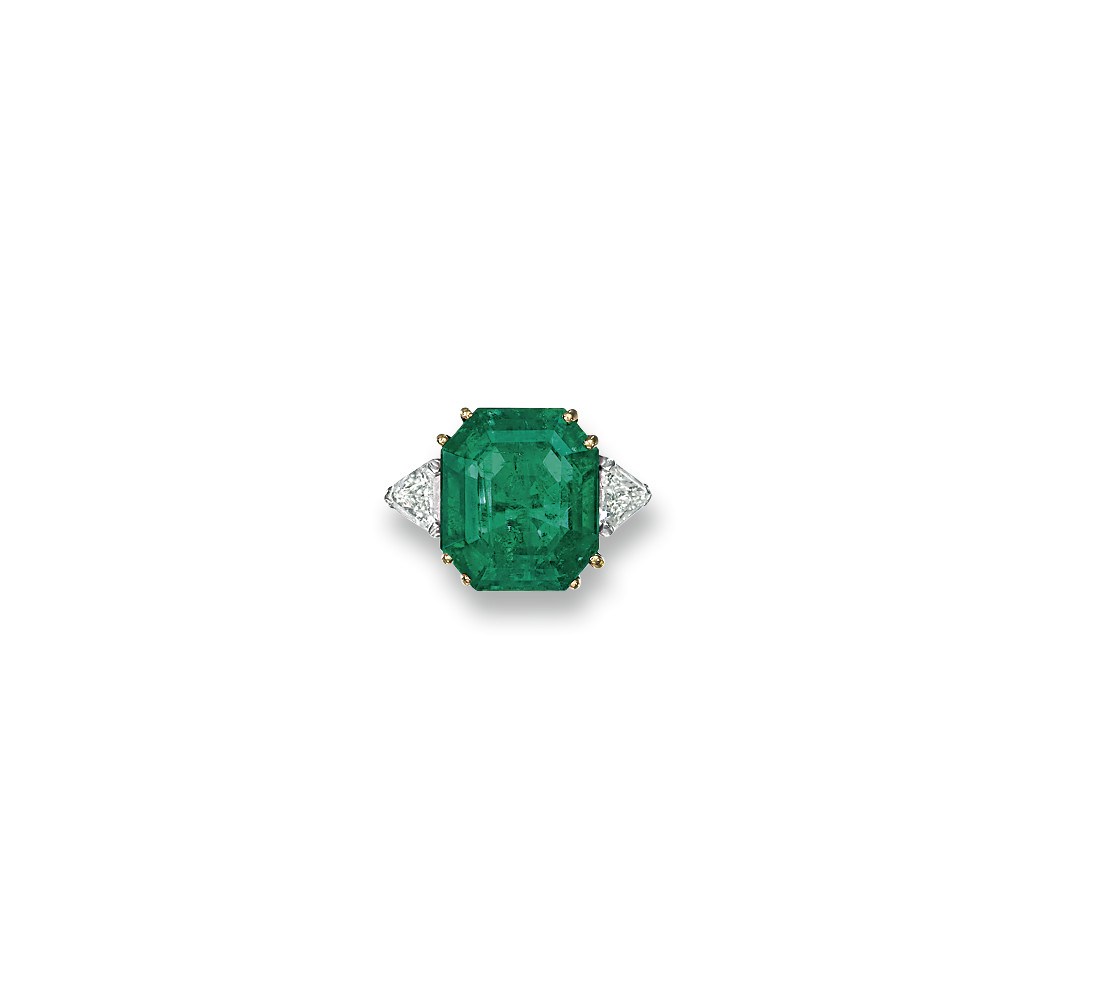 AN EMERALD AND DIAMOND RING