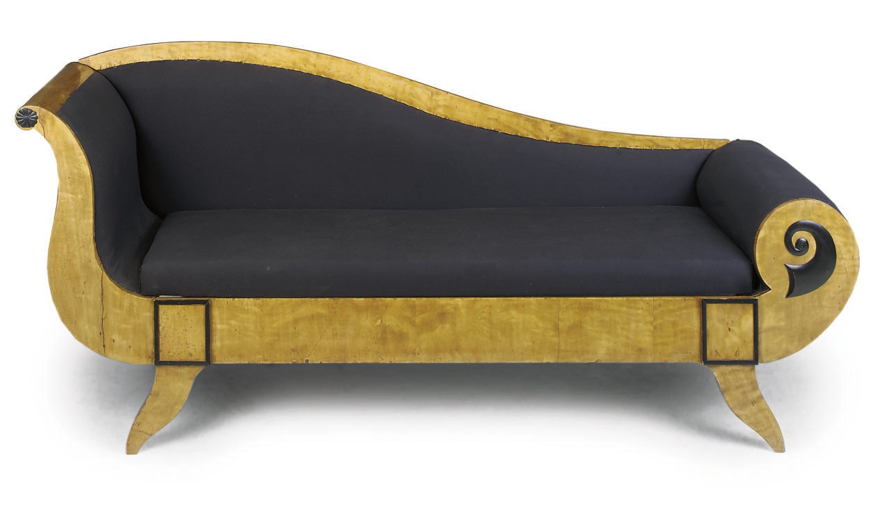A BIEDERMEIER BIRCH AND EBONISED CHAISE-LONGUE
