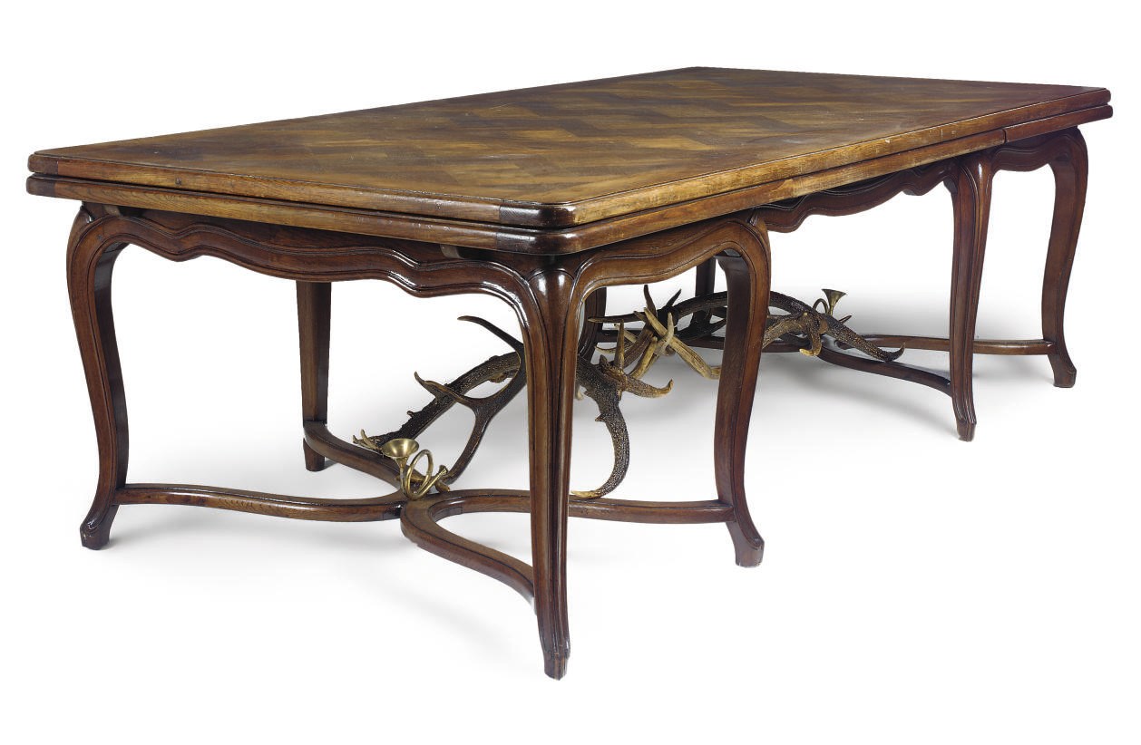 A FRENCH OAK DRAWER LEAF DINING TABLE