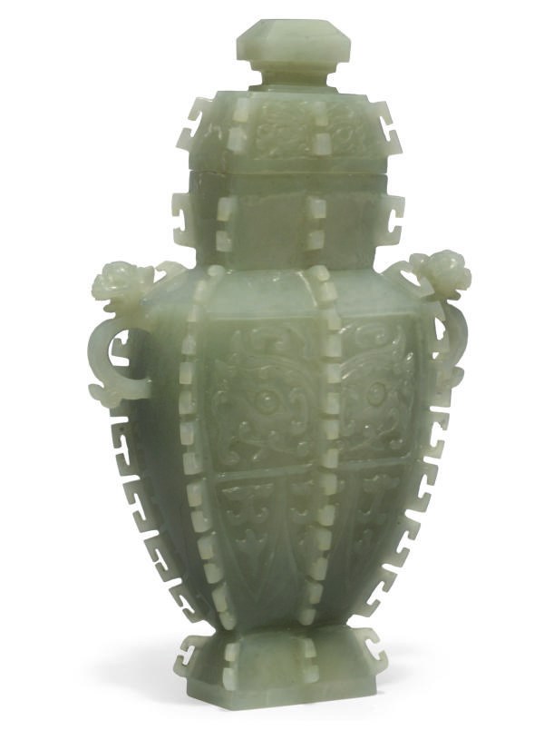 A Chinese pale celadon jade vase and cover