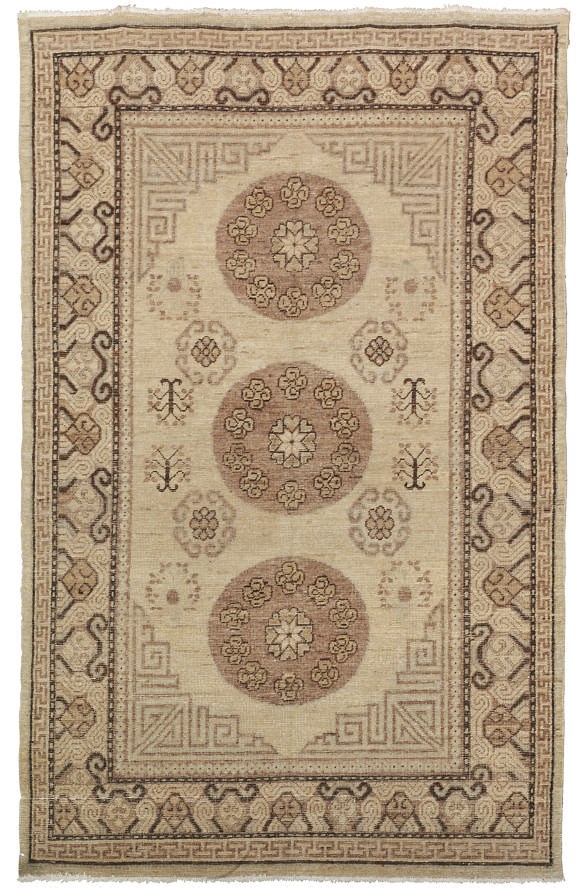 An antique Khotan large rug