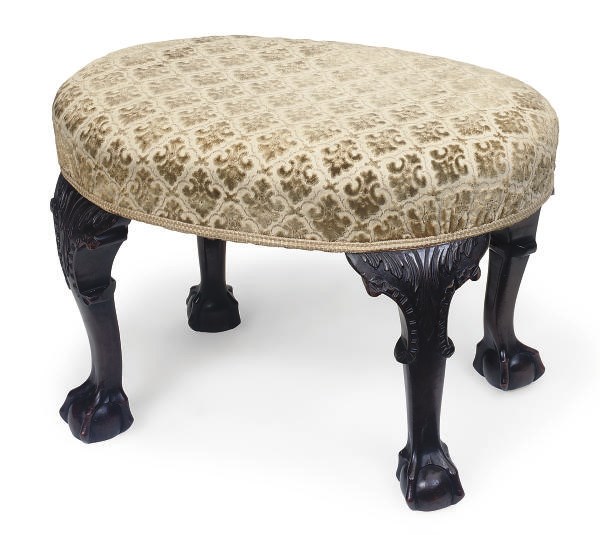 A CARVED MAHOGANY STOOL