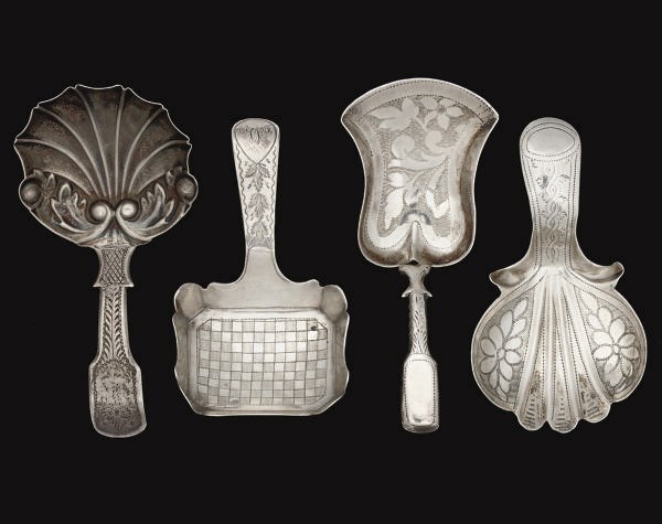 A GROUP OF FOUR SILVER CADDY SPOONS