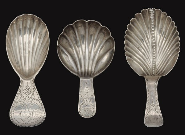 A GROUP OF THREE GEORGE III SILVER CADDY SPOONS