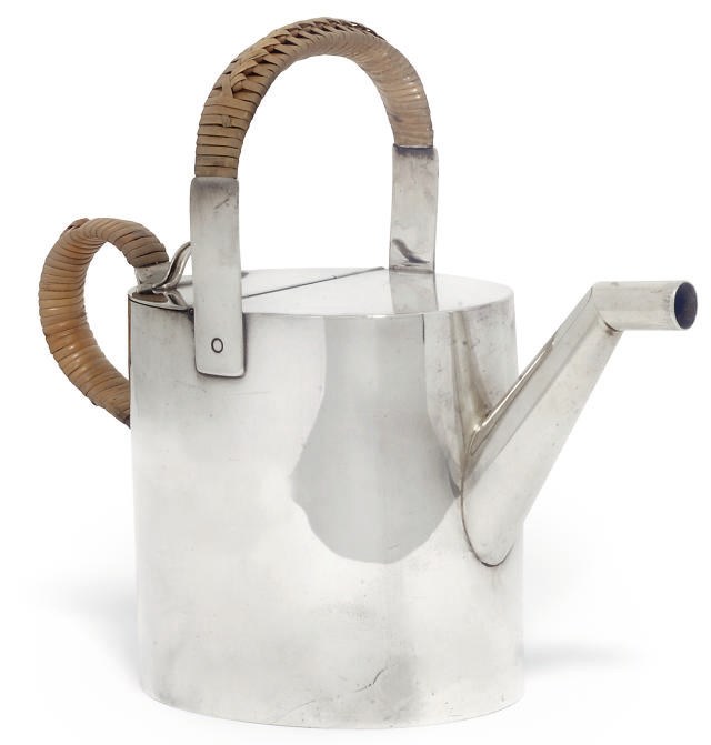 A LATE VICTORIAN NOVELTY SILVER TEAPOT IN THE FORM OF A WATERING CAN