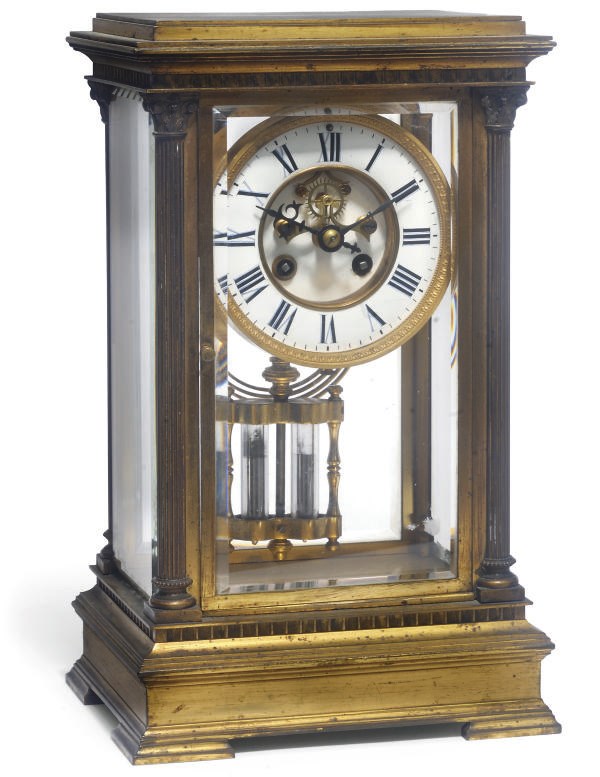 A Victorian gilt-brass striking eight day four glass mantel clock