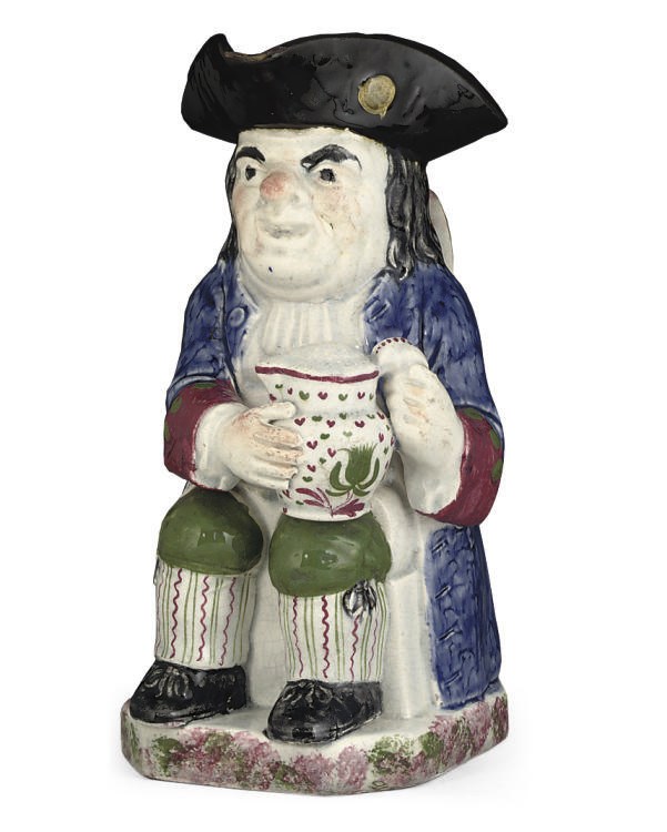 A PEARLWARE TOBY-JUG