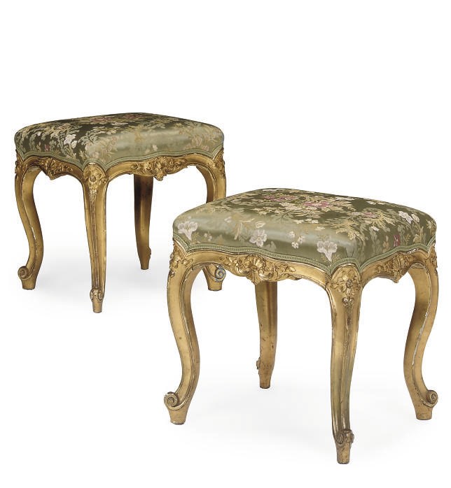 A PAIR OF CARVED GILTWOOD STOOLS
