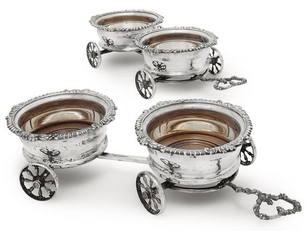 A PAIR OF ELECTROPLATED DOUBLE COASTER WINE TROLLIES IN THE EARLY 19TH CENTURY MANNER