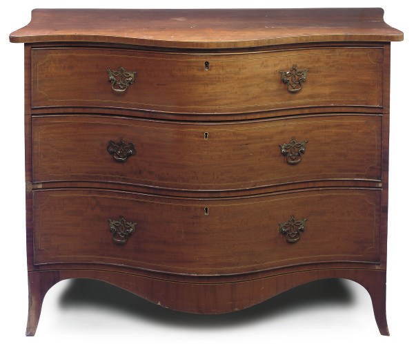 A REGENCY MAHOGANY LINE INLAID SERPENTINE CHEST