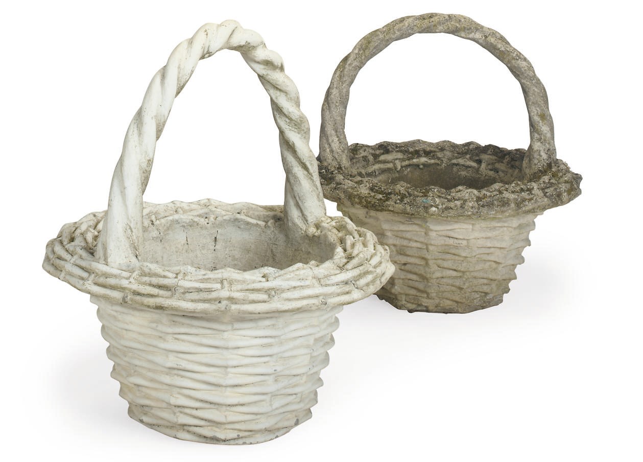 A PAIR OF LARGE COMPOSITE STONE WICKER BASKETS