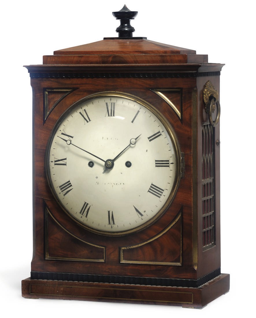 A Regency brass-mounted striking eight day table clock