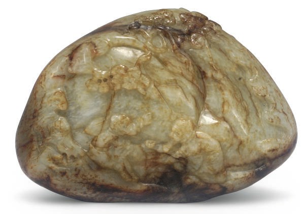 A Chinese celadon and russet jade mountain group
