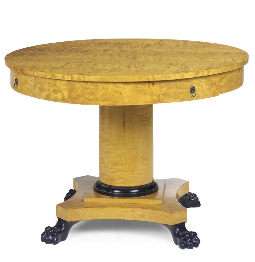 A BURR BIRCH AND EBONISED CIRCULAR CENTRE TABLE