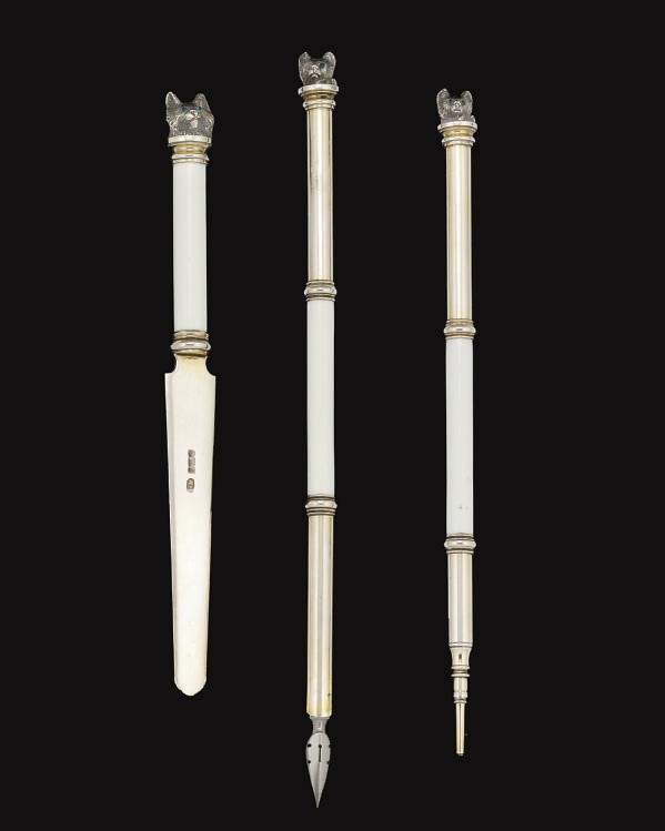 AN EARLY 20TH CENTURY THREE-PIECE PARCEL-GILT SILVER & ENAMEL NOVELTY DESK SET