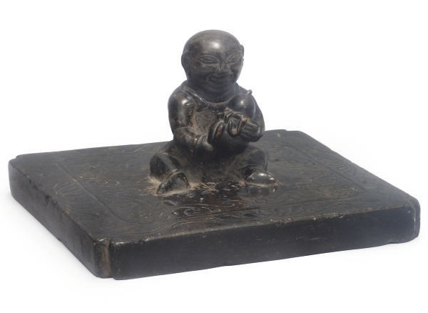 A Chinese stone weight, possibly a childs tethering stone