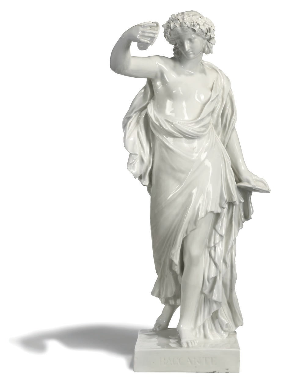A CONTINENTAL WHITE PORCELAIN FIGURE OF A BACCHANTE