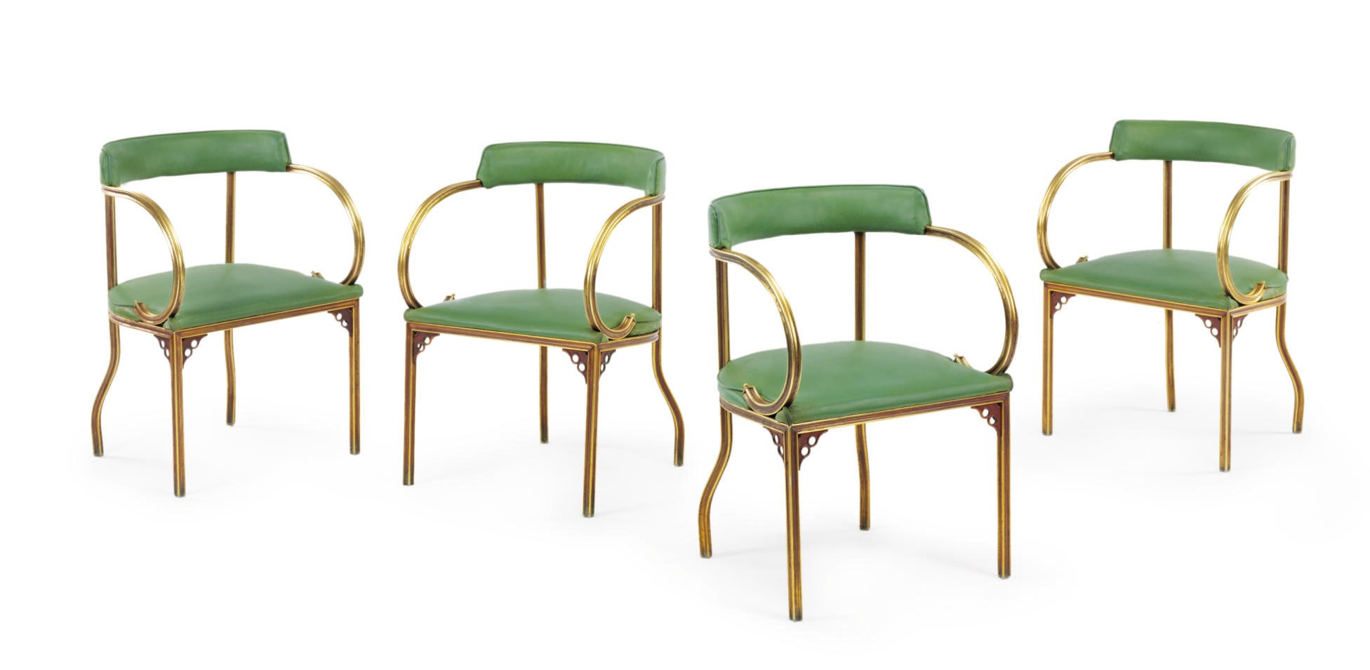 A set of four gilt metal open arm chairs used on board the S.S. United States