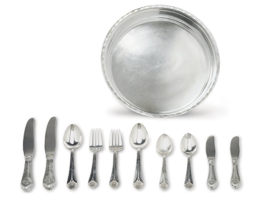 A five 7 piece 1st class flatware place settings used on board the S.S. United States with a mellon tray