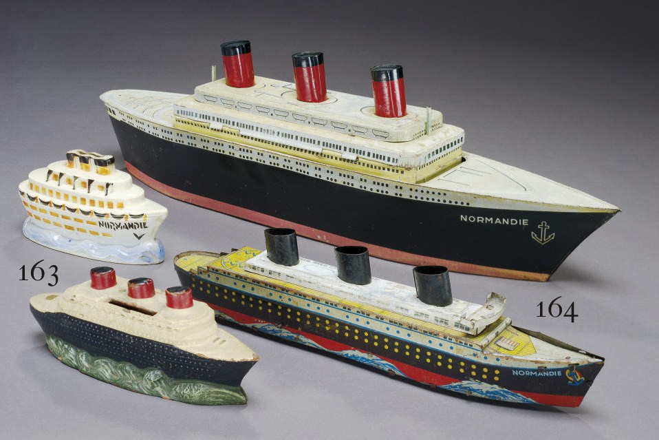 A lithographed biscuit tin in the form of the S.S. Normandie
