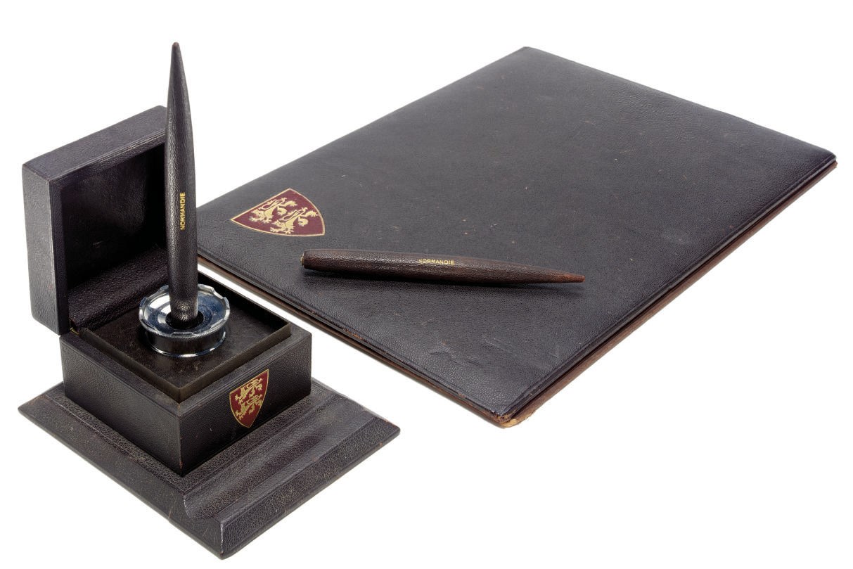 A brown leather desk set for the S.S. Normandie