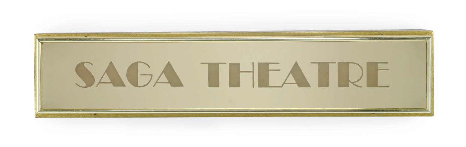 A metal and mirrored sign for the "Saga Theatre" on board the S.S. Norway