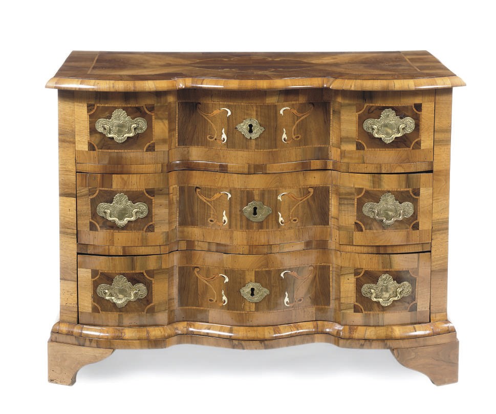 A NORTH GERMAN FIGURED WALNUT, ASH AND IVORY INLAID COMMODE