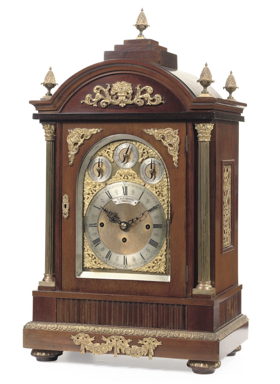 AN ENGLISH GILT-BRASS MOUNTED MAHOGANY QUARTER CHIMING TABLE CLOCK