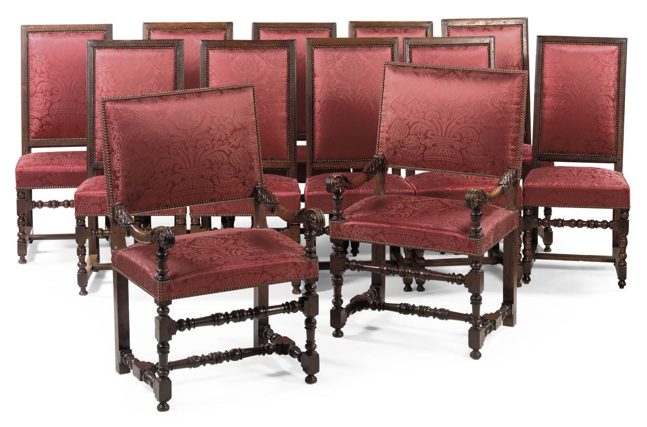 A MATCHED SET OF TEN WALNUT SIDE CHAIRS AND TWO ARMCHAIRS