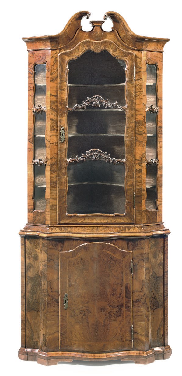A GERMAN FIGURED-WALNUT CORNER CUPBOARD