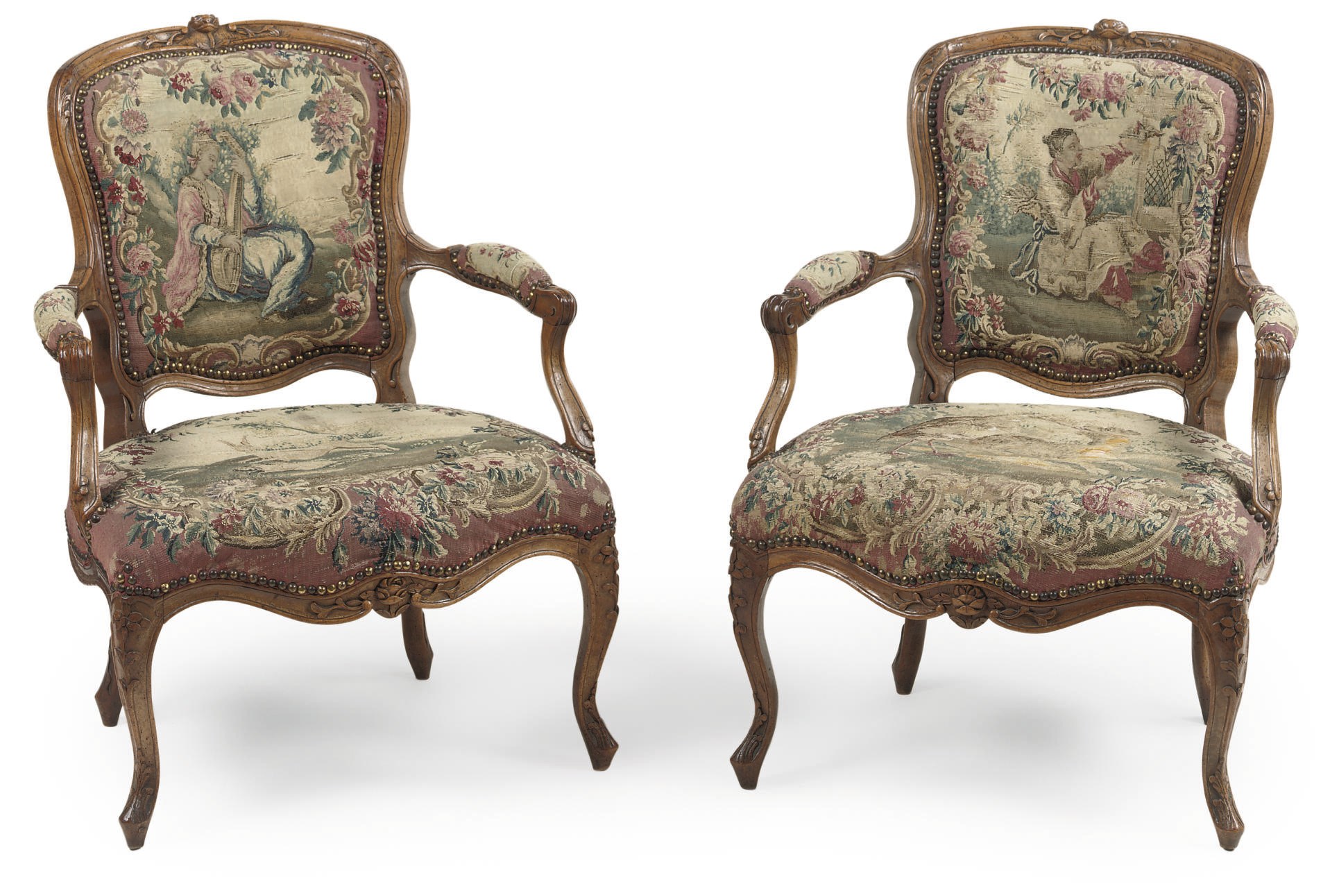 A PAIR OF LOUIS XV WALNUT FAUTEUILS EN CABRIOLET
