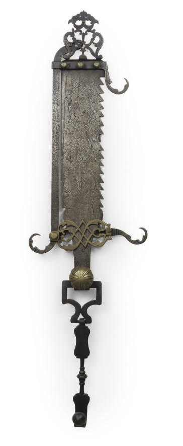 A GERMAN WROUGHT-IRON AND BRASS HEARTH SAW