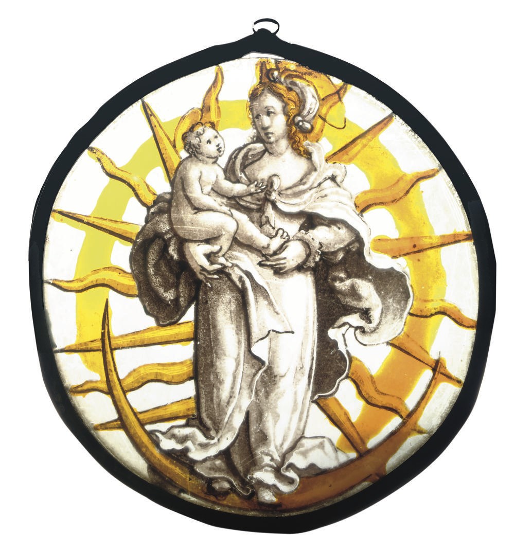 A STAINED GLASS TONDO DEPICTING THE VIRGIN AND CHILD