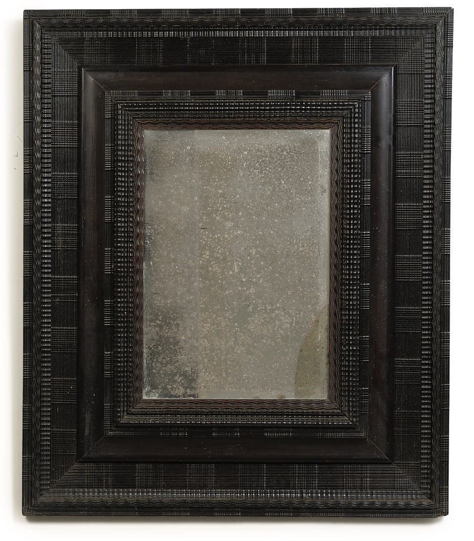 A DUTCH EBONISED RIPPLE MOULDED MIRROR
