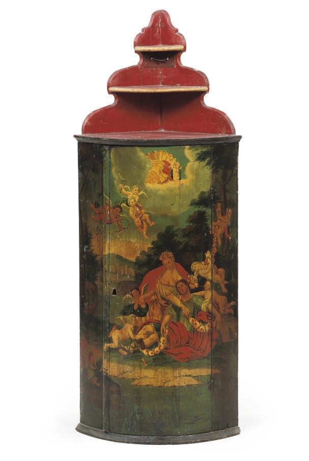 A DUTCH POLYCHROME DECORATED CORNER CUPBOARD