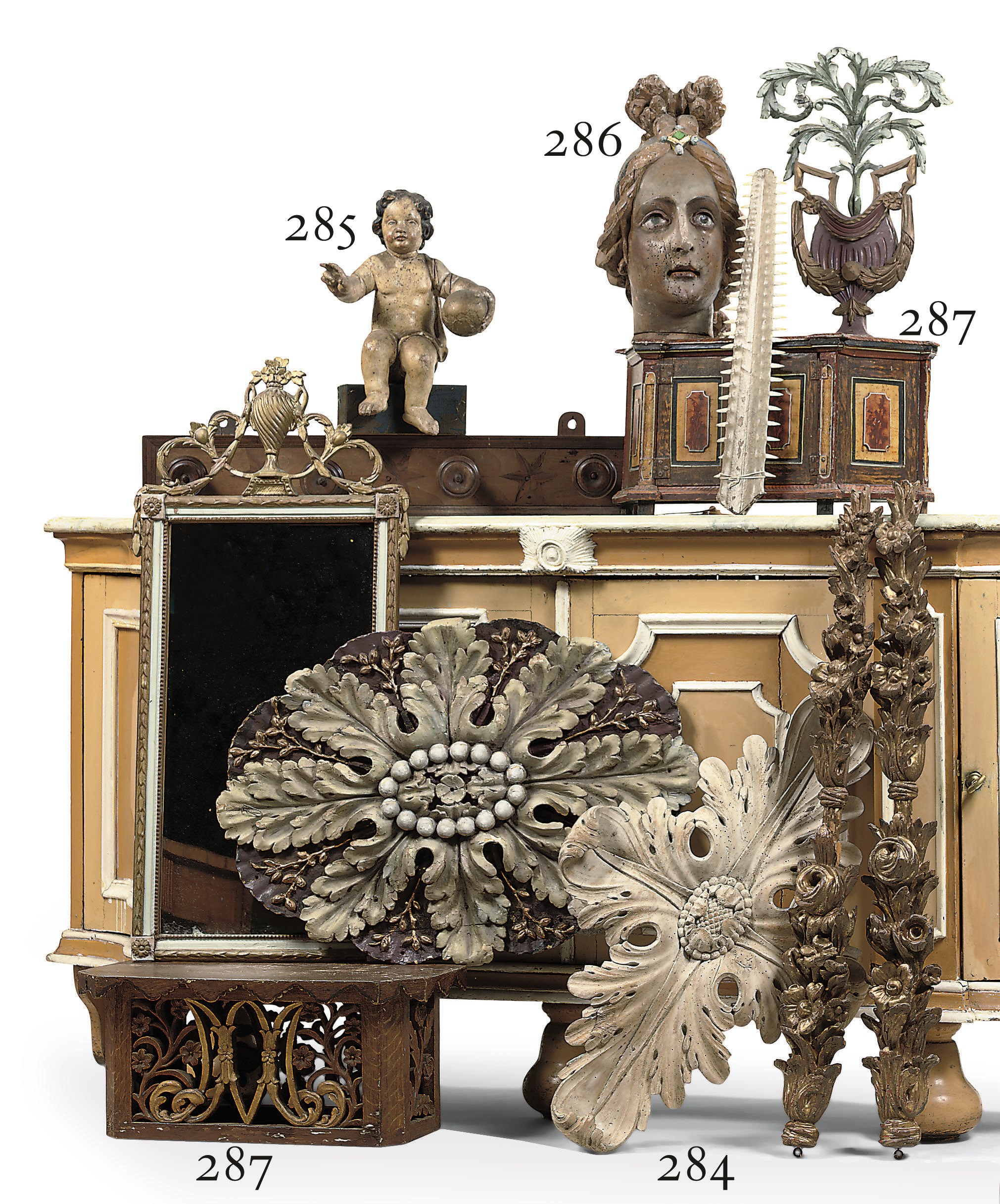 A DUTCH POLYCHROME AND PARCEL-GILT CARVED LIMEWOOD FEMALE HEAD