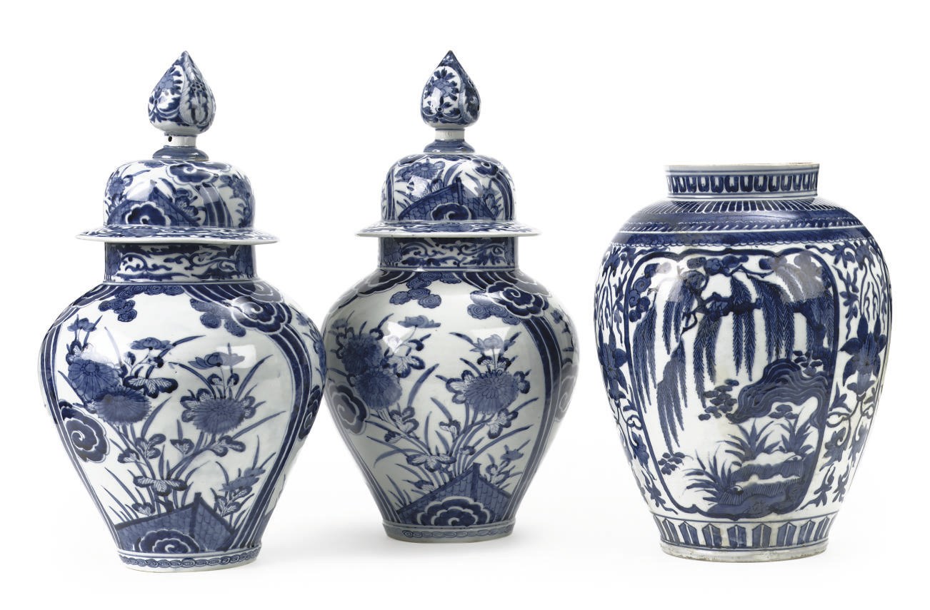 A pair of Japanese Arita blue and white baluster jars and covers and an Arita jar