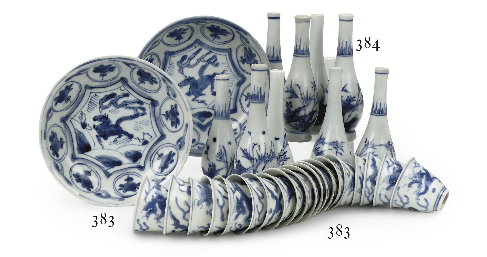 A set of twenty Chinese Transitional 'Hatcher cargo' blue and white wine-cups and a pair of 'kraak porselein' saucers