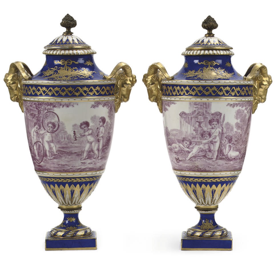 A PAIR OF CERAMIC GILT VASES AND COVERS