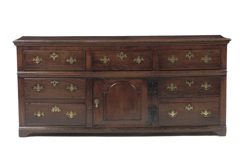 AN ENGLISH BRASS-MOUNTED OAK DRESSER