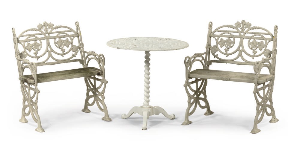 A PAIR OF NORTH EUROPEAN WHITE PAINTED CAST-IRON GARDEN SEATS