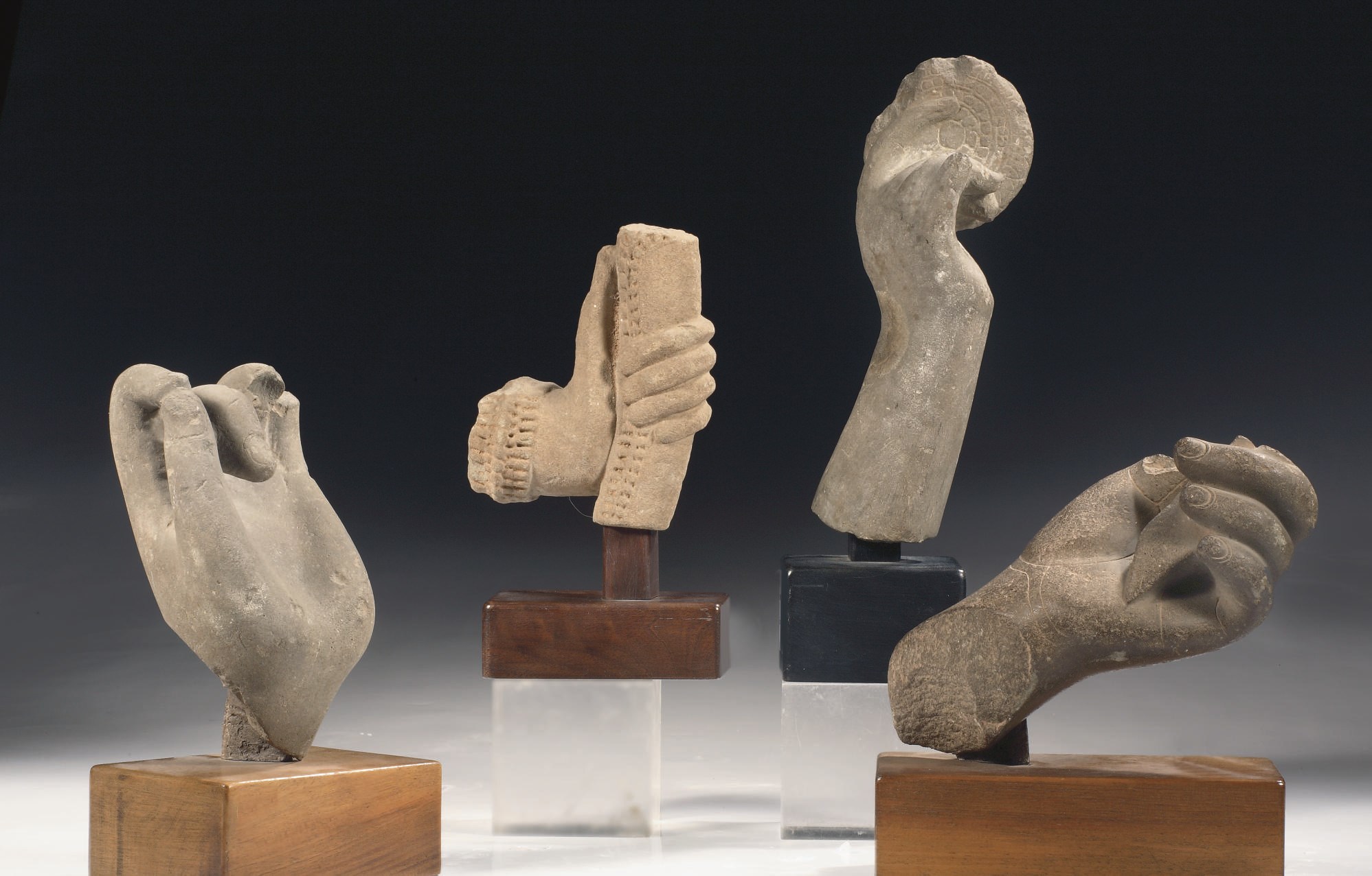 Two Indian and two Khmer stone hands