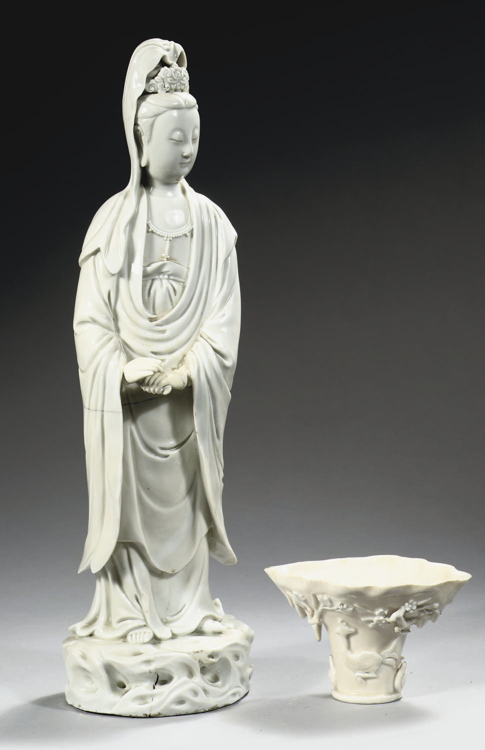 A Chinese blanc-de-chine figure of Guanyin and a blanc-de-chine libation cup
