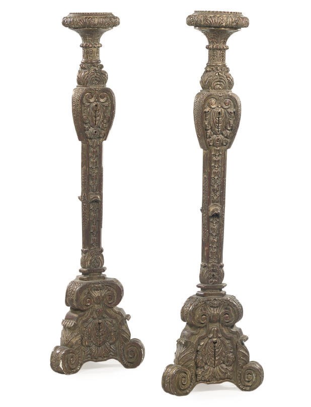 A PAIR OF CARVED GILTWOOD TORCHERES